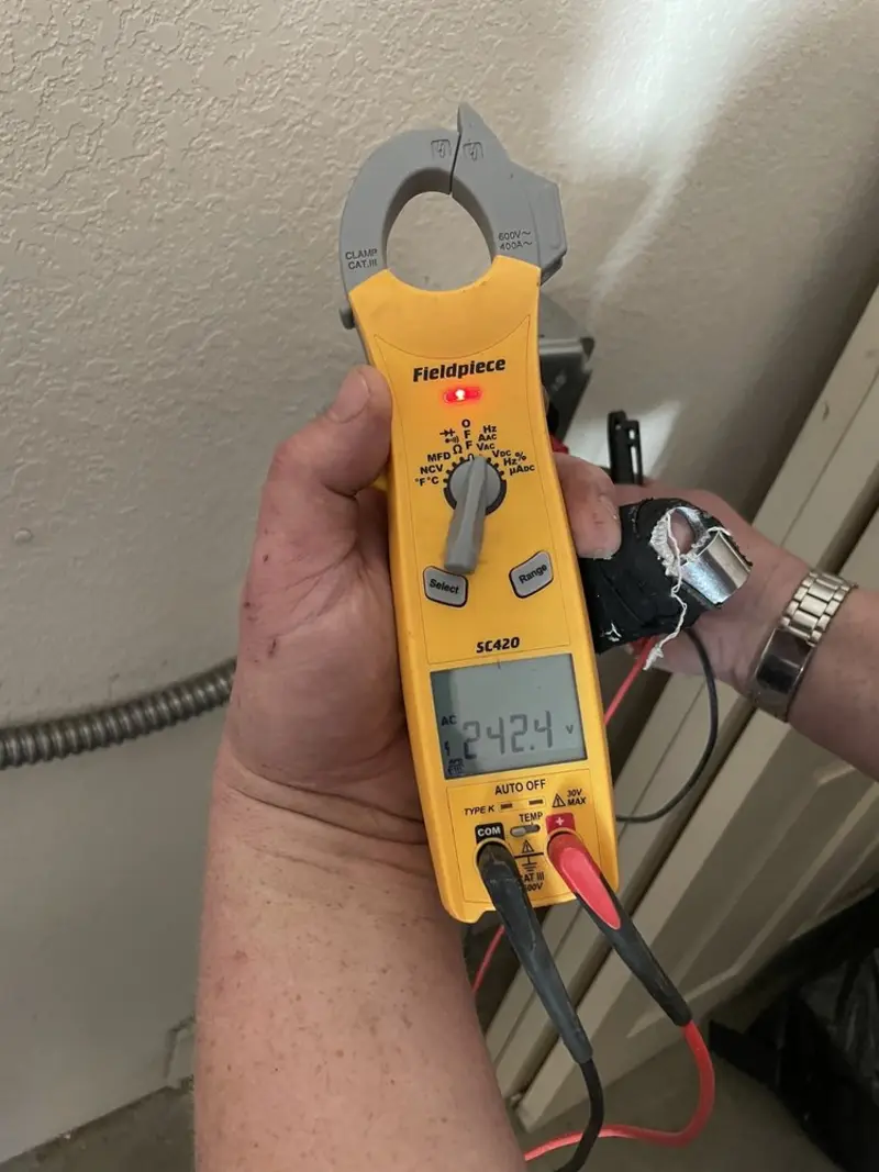 Voltage testing with clamp meter during Circuit Breaker Repair in Providence Village